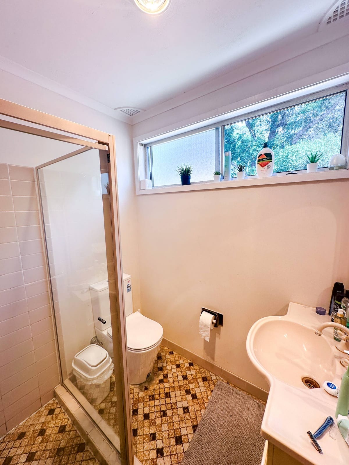 Upstairs bathroom, looking through to a dining table
